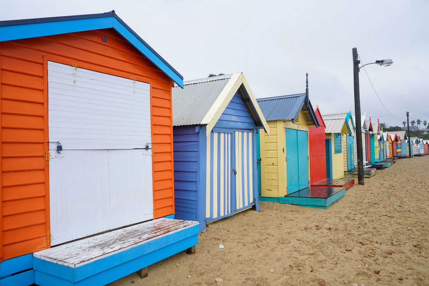 Some Brighton Bathing Boxes are more like each other than others. “Show me those in red” [photo by me]